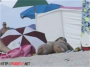 Beach sweeties hang out naked below the sun
